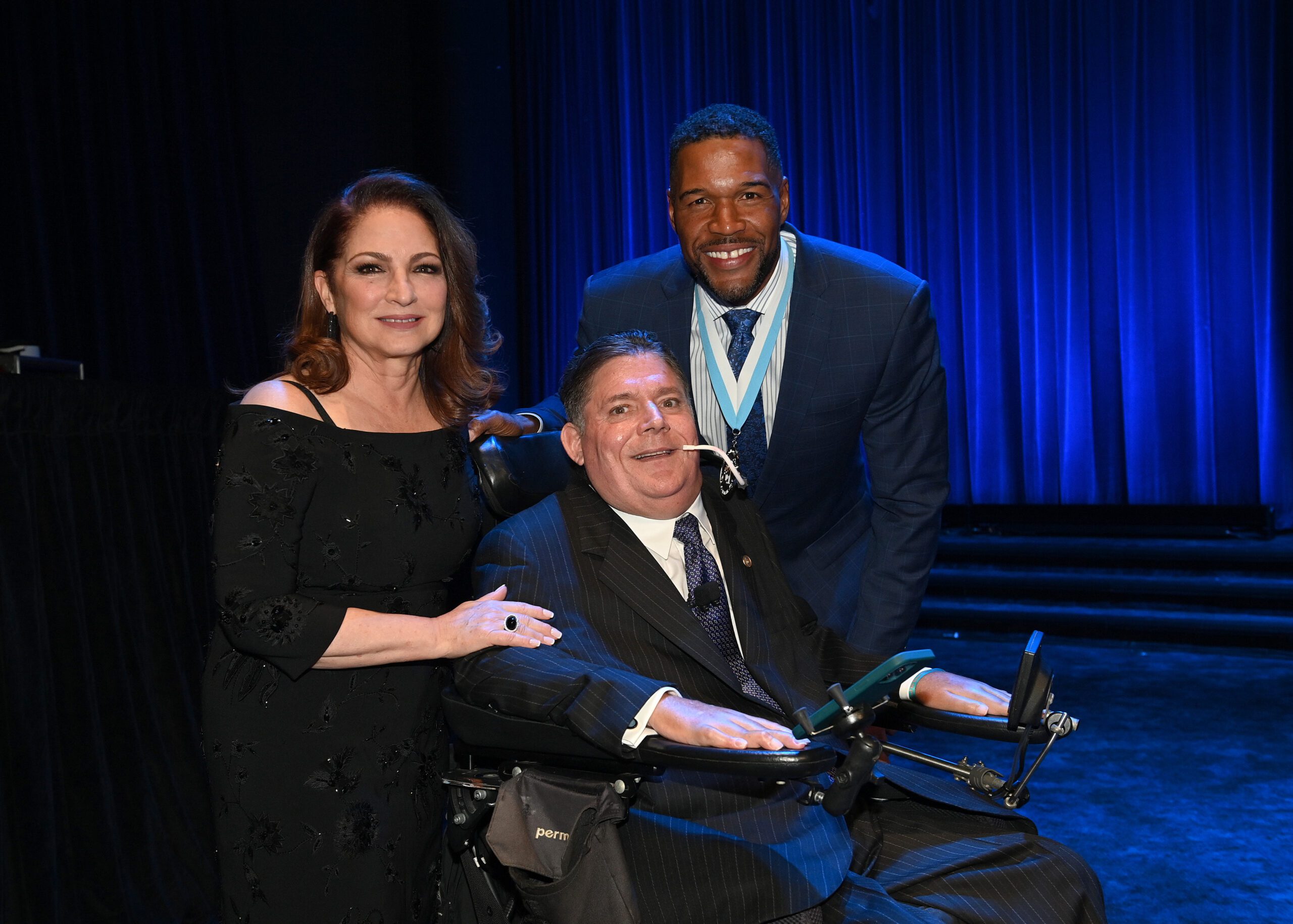 Gloria Estefan with Marc Buoniconti and Michael Strahan (Photo by Mike Coppola/Getty Images for The Buoniconti Fund to Cure Paralysis)