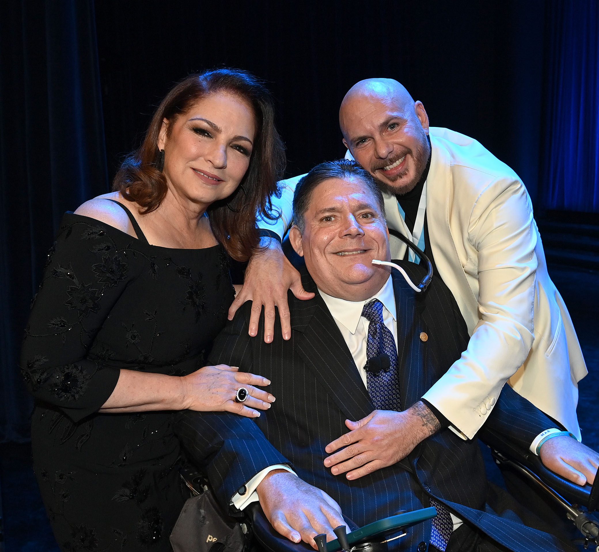 Gloria Estefan, Marc Buoniconti and Pitbull (Photo by Bryan Bedder/Getty Images for The Buoniconti Fund To Cure Paralysis)