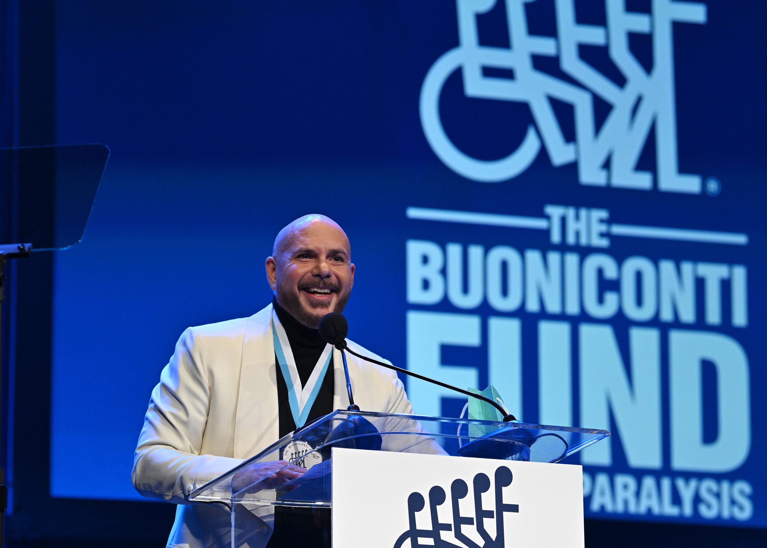 Pitbull speaks onstage Photo by Bryan Bedder/Getty Images for The Buoniconti Fund To Cure Paralysis)