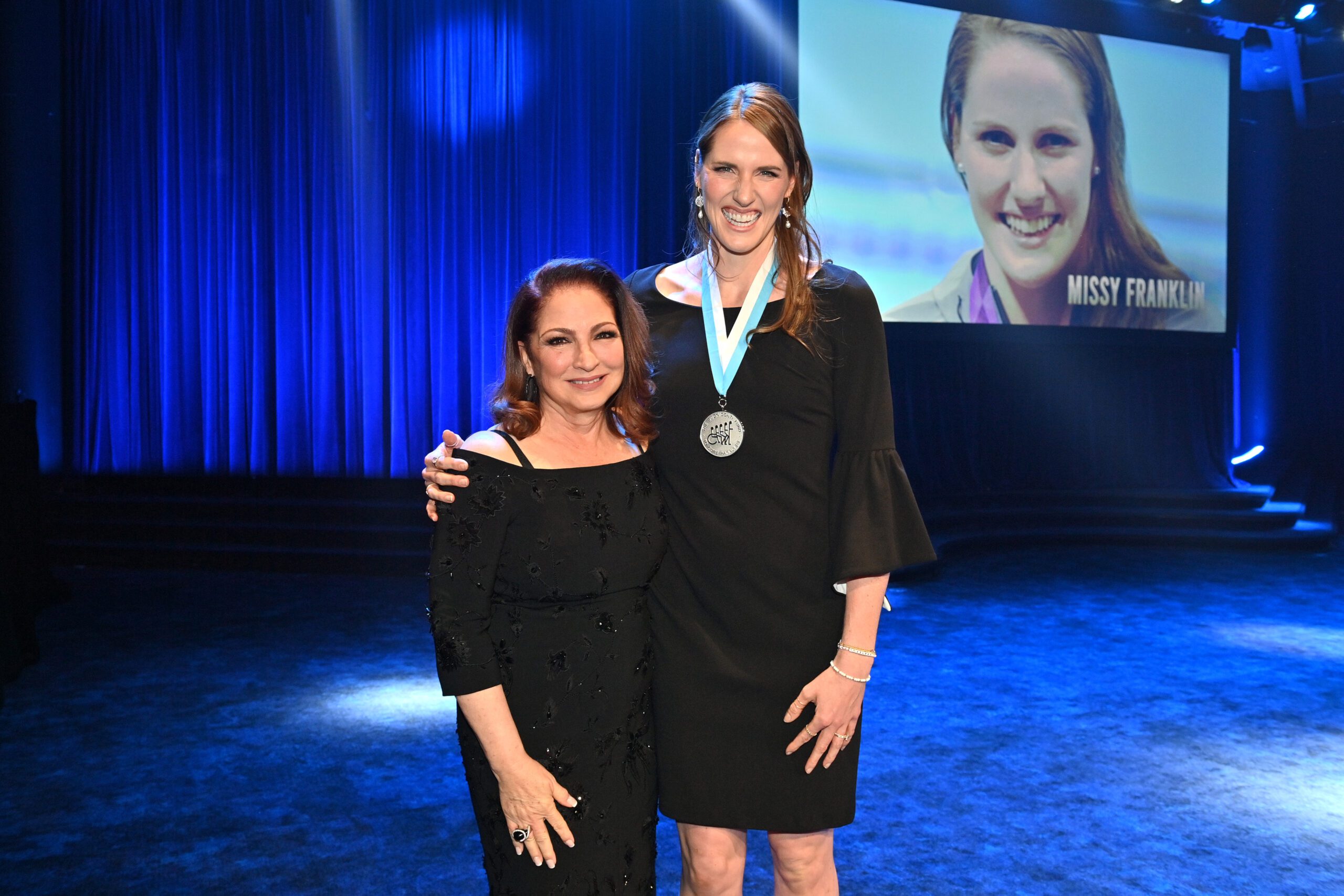 Gloria Estefan with Missy Franklin (Photo by Bryan Bedder/Getty Images for The Buoniconti Fund To Cure Paralysis)