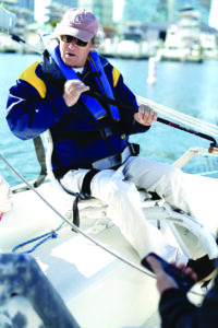 Harry Horgan, co-founder and president of Shake-A-Leg Miami, at the helm.